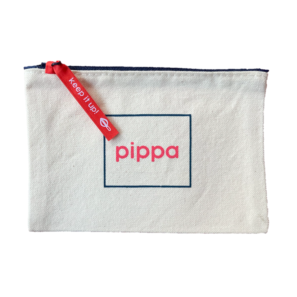 Rectangular white canvas pouch with dark blue zipper at the top. The pouch features a simple, centered graphic of "pippa" in the brand's red-pink color centered inside a dark blue rectangular outline. A pink-red woven zipper pull reads "keep it up" and has a Pippa resistance silhouette in white thread.